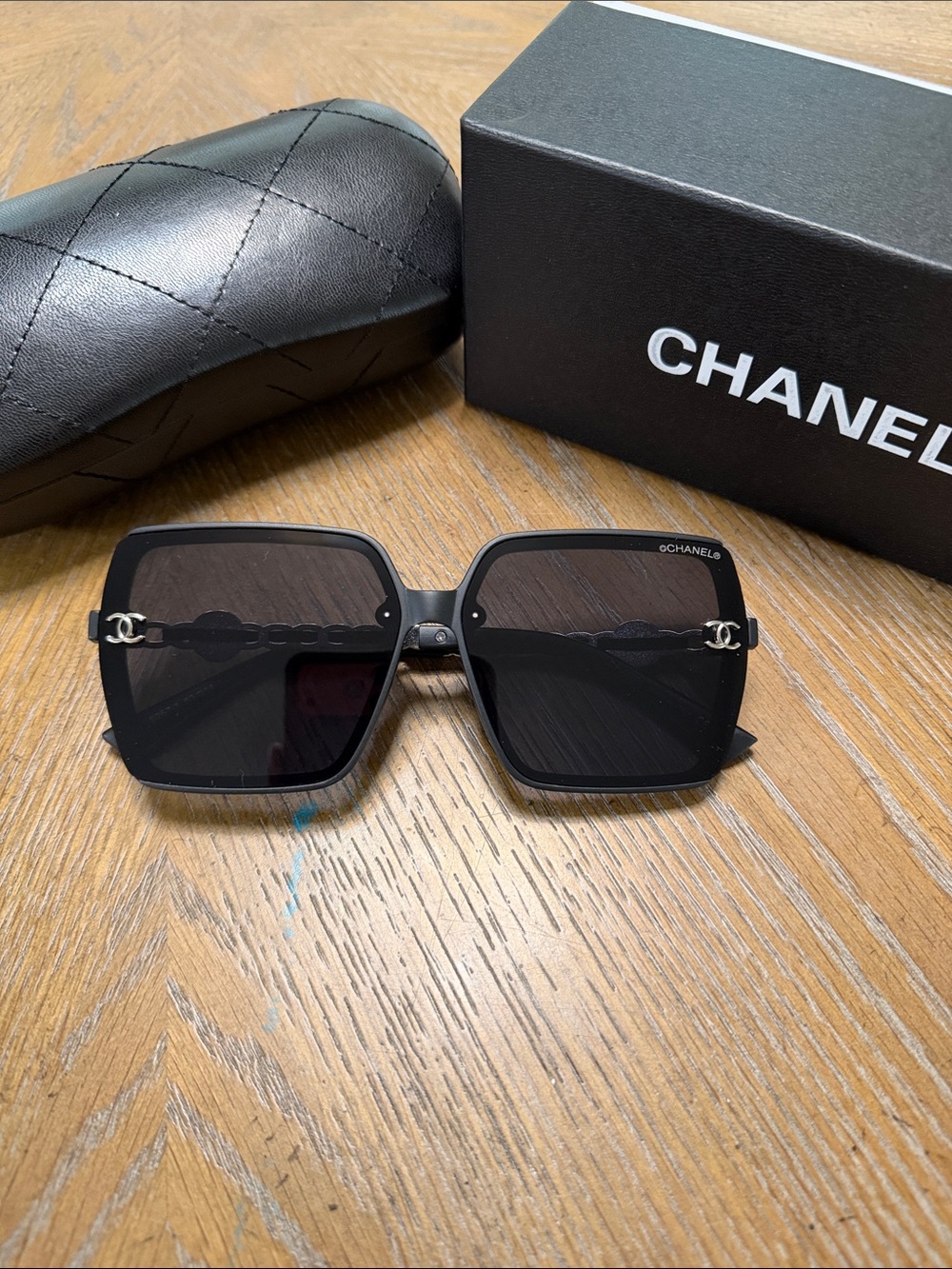 CHANEL Black Square Sunglasses with Silver CC Chain Accent